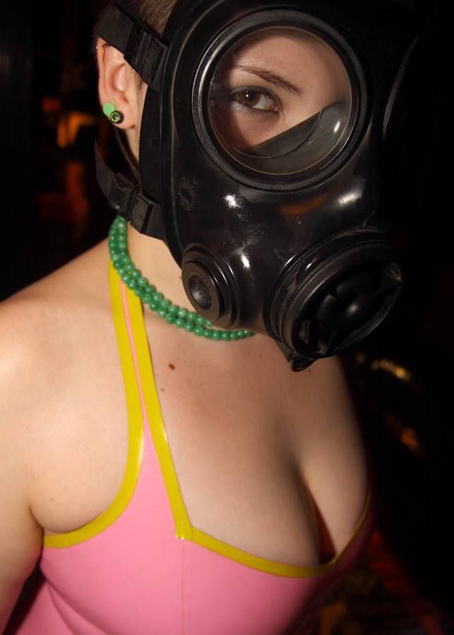 Gasmask Girl with pierced tits.